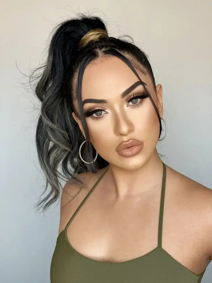 july hairstyles ideas 2025 Snatched Ponytail with Money-Piece Drama