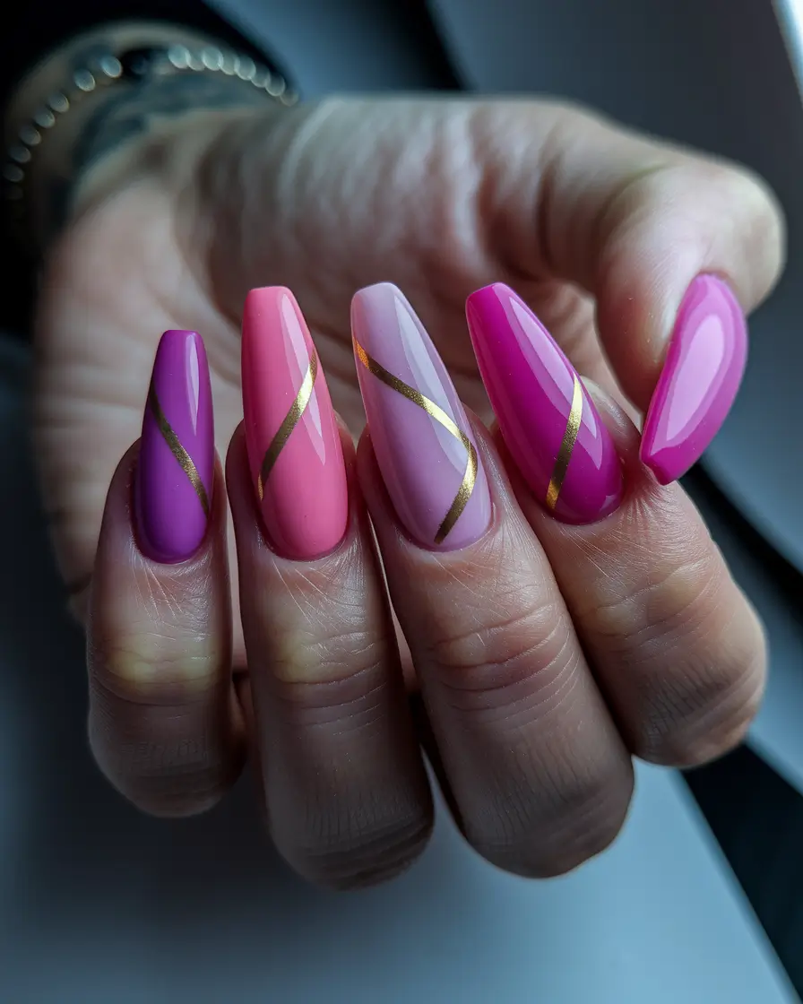 july nails colors 2025 Purple and Pink Swirls with Gold Accents