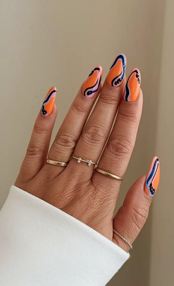 june nail art ideas 2025 Sunset Orange and Retro Curves