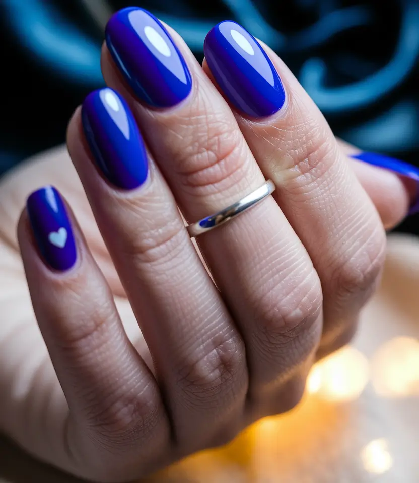 simple summer nails ideas 2025 Ultra-Glossy Indigo with Heart Accent