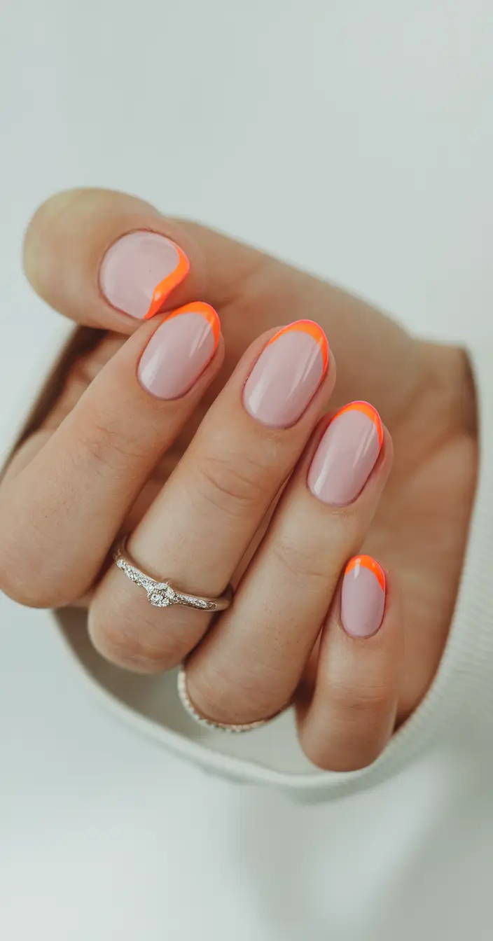 summer nails color ideas 2025 Neon Orange French Tips for a Pop of Color