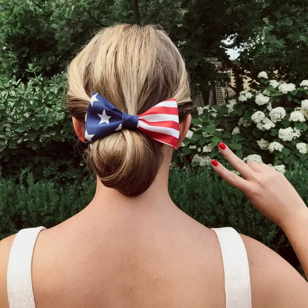 july nails ideas 2025 Stars & Stripes Low Bun with a Classic Bow