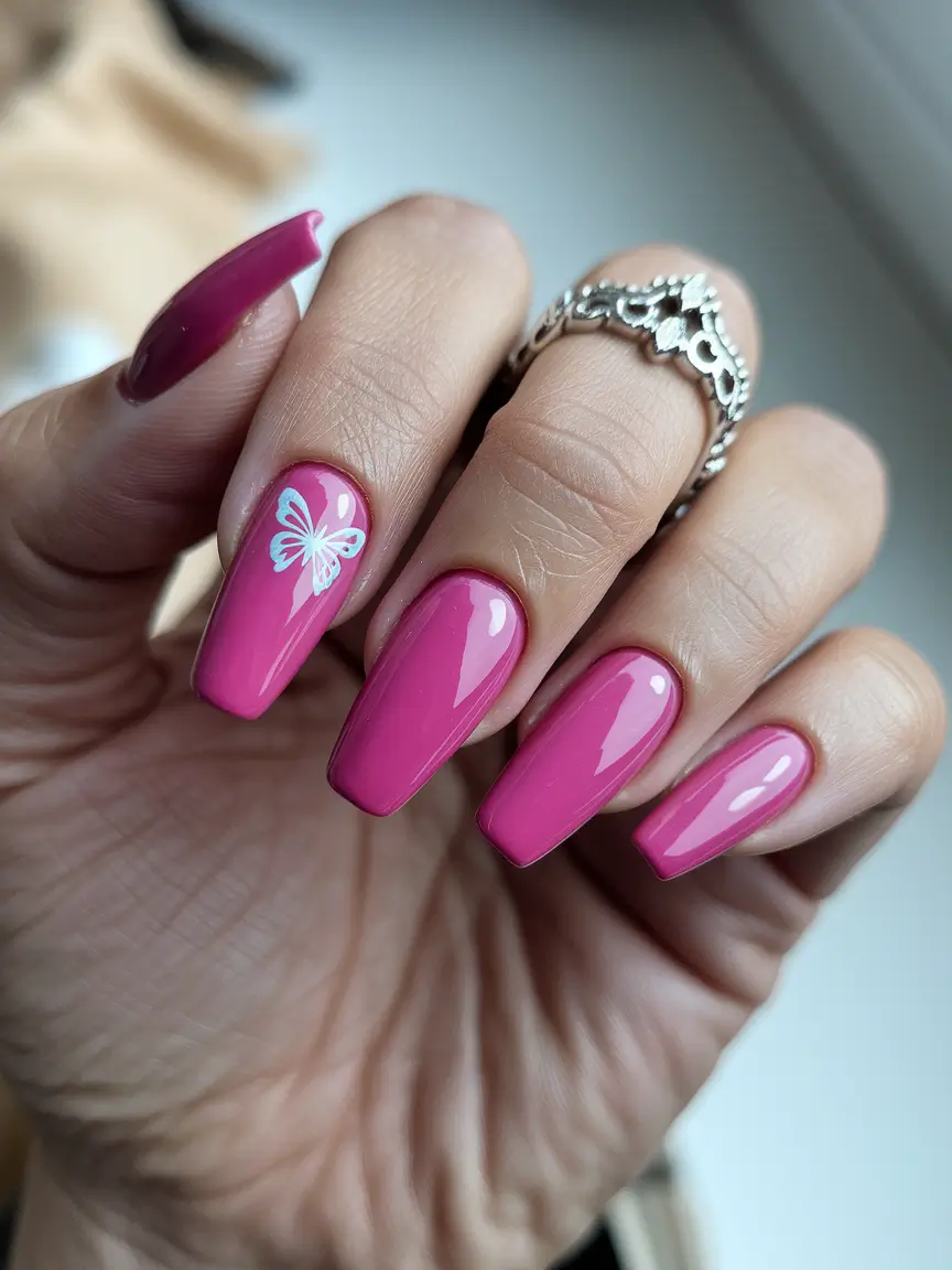 pink summer nails 2025 Glossy Pink with Butterfly Accent