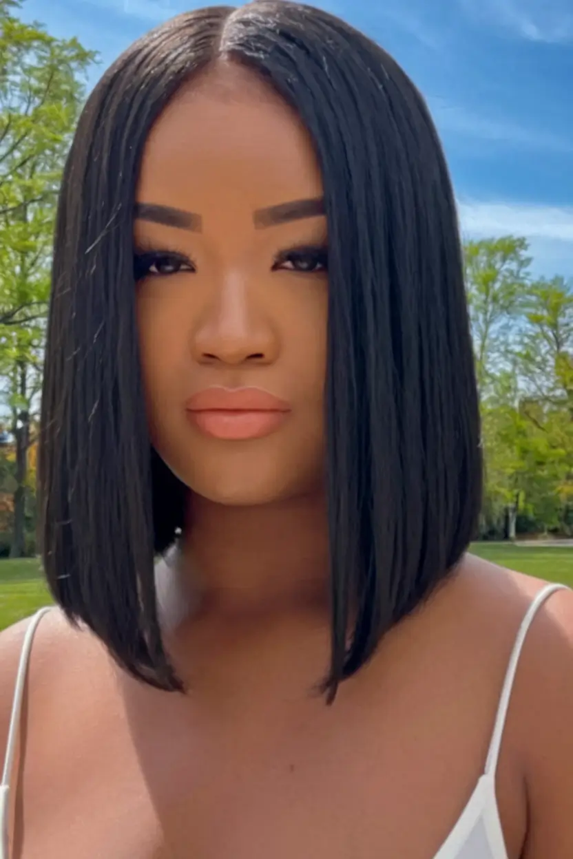 fall bob haircut Sleek Perfection with a Sharp Center Part