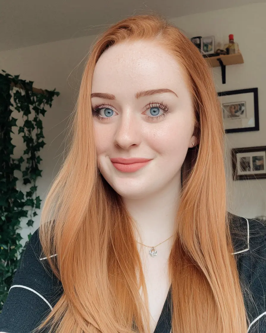 warm fall hair color red Muted Strawberry Blonde With a Creamy Finish